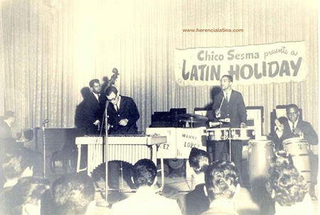 'Rótulo detrás de Cal Tjader dice: Chico Sesma presents a Latin Holiday, para más información de Chico, busca el periódico de Eagle Rock Sentinel, volumen 27, número 72, 22 de diciembre de 1960